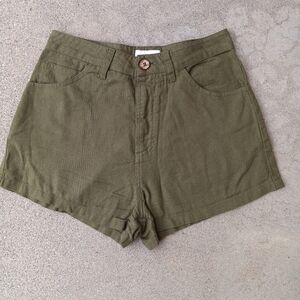 RVCA army Green lightweight shorts with wooden button closure.